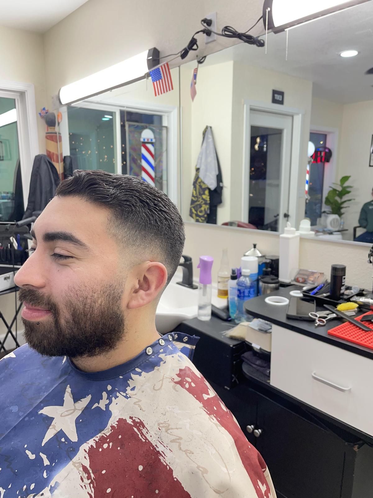 Client with a short fade seated in the barbershop